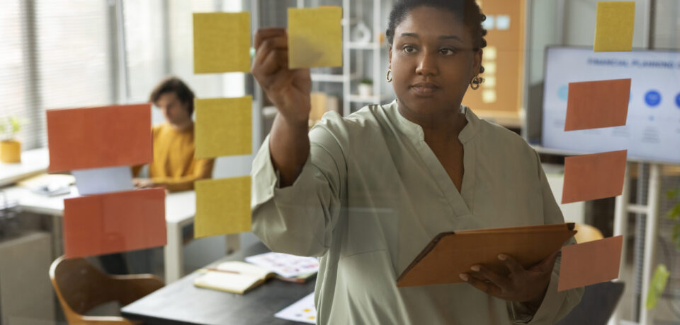 front-view-woman-working-with-post-its
