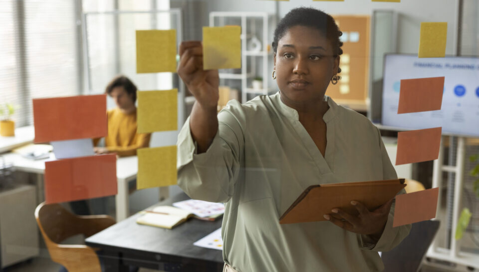 front-view-woman-working-with-post-its